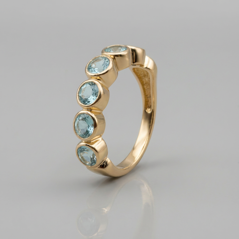 Meia aliança de topázio azul