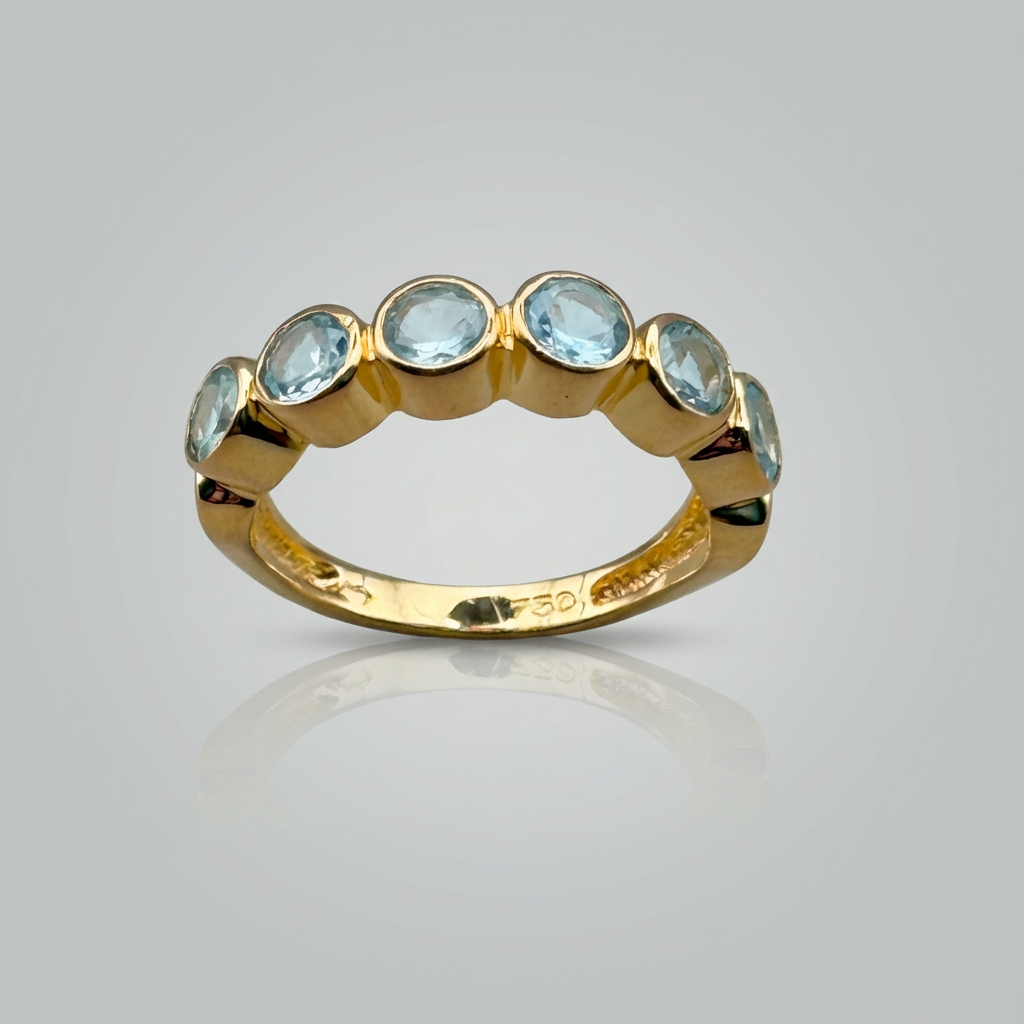 Meia aliança de topázio azul